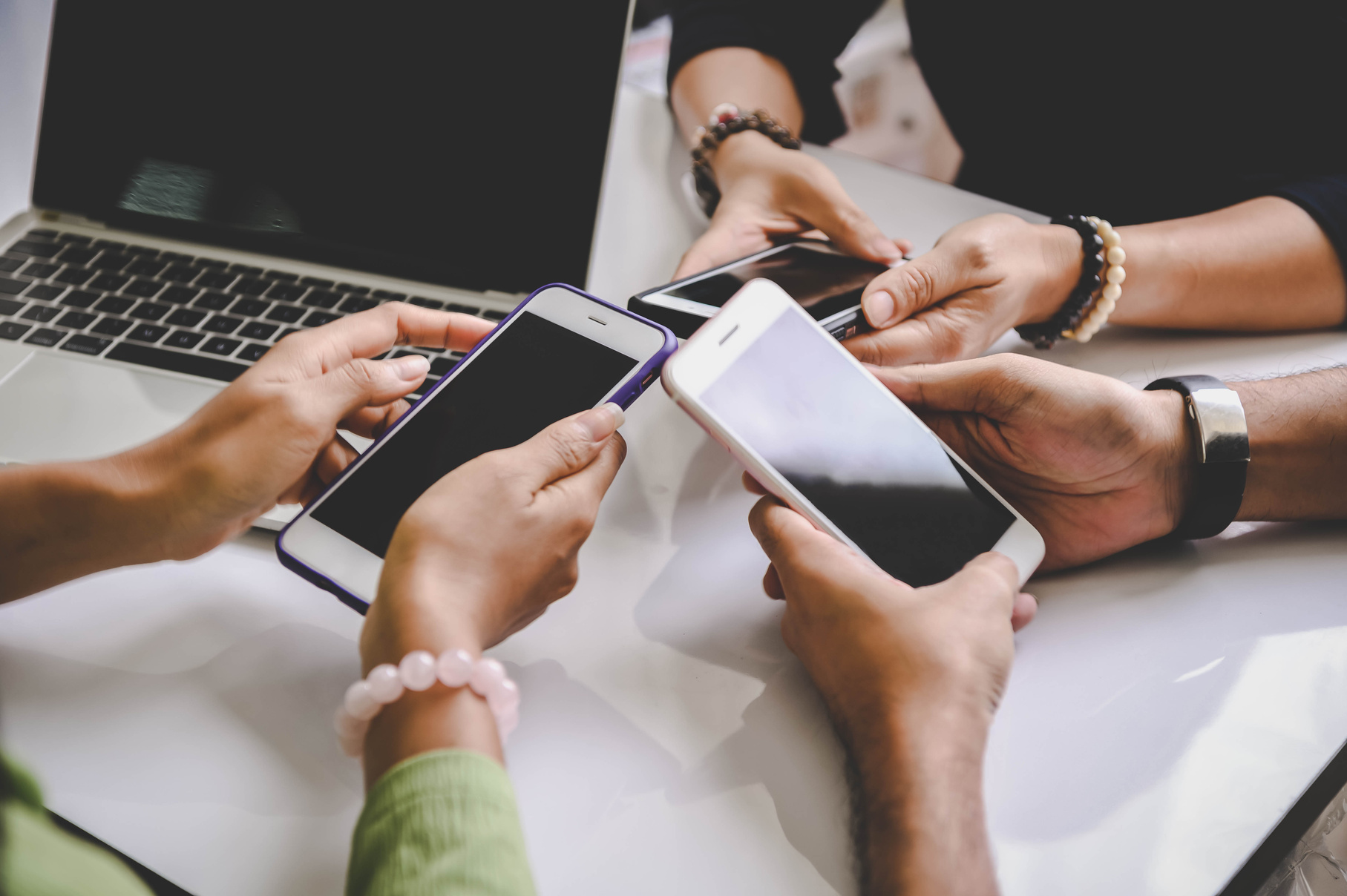 Friends Holding Mobile Phones